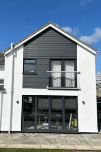 Photo of an external wall of a house that Prime Signature Designs sprayed white