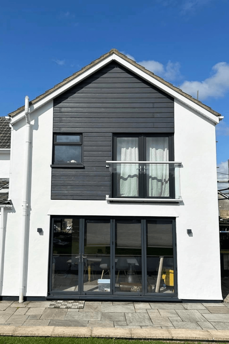 Photo of an external wall of a house that Prime Signature Designs sprayed white