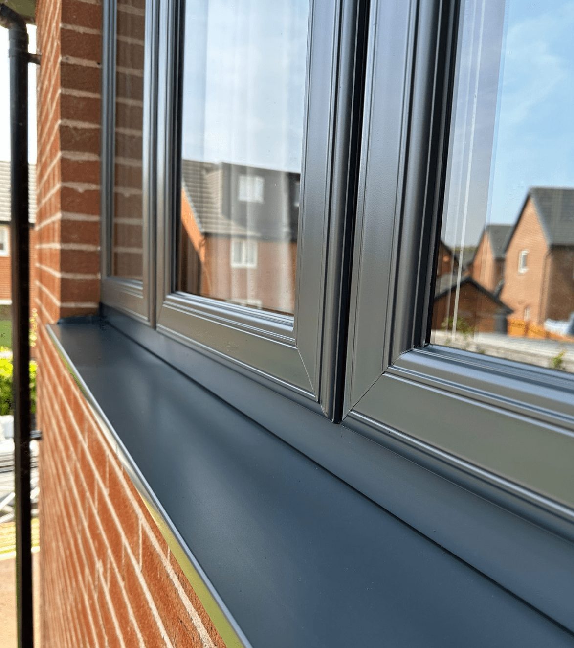 Photo of grey house window after it's been sprayed