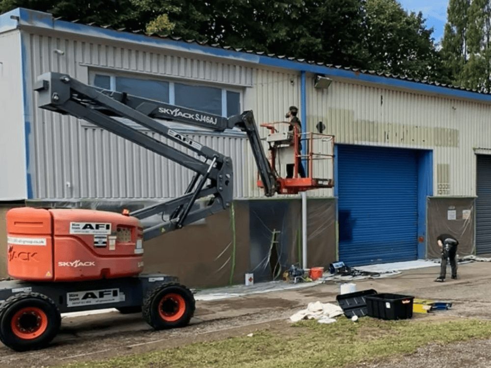 Prime Signature Designs preparing a commercial building for spraying